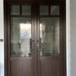 brown french entrance door with one of our glass options that allow daylight to come in but still allows for privacy
